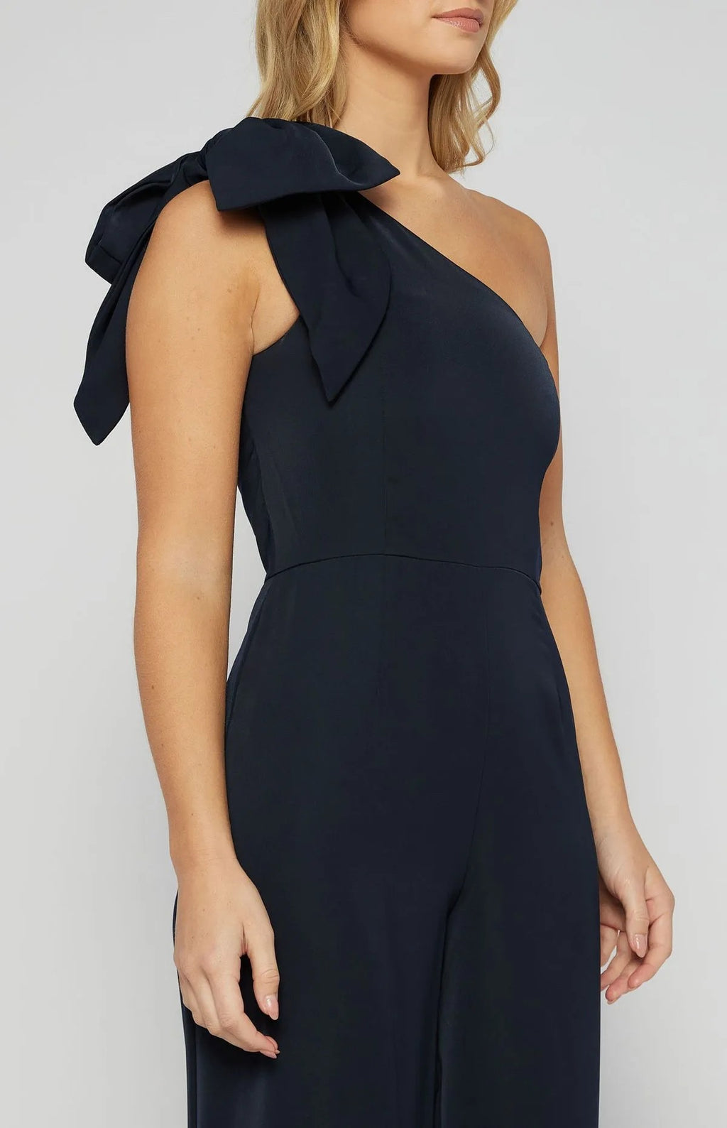 NAVY ONE SHOULDER JUMPSUIT WITH LARGE BOW