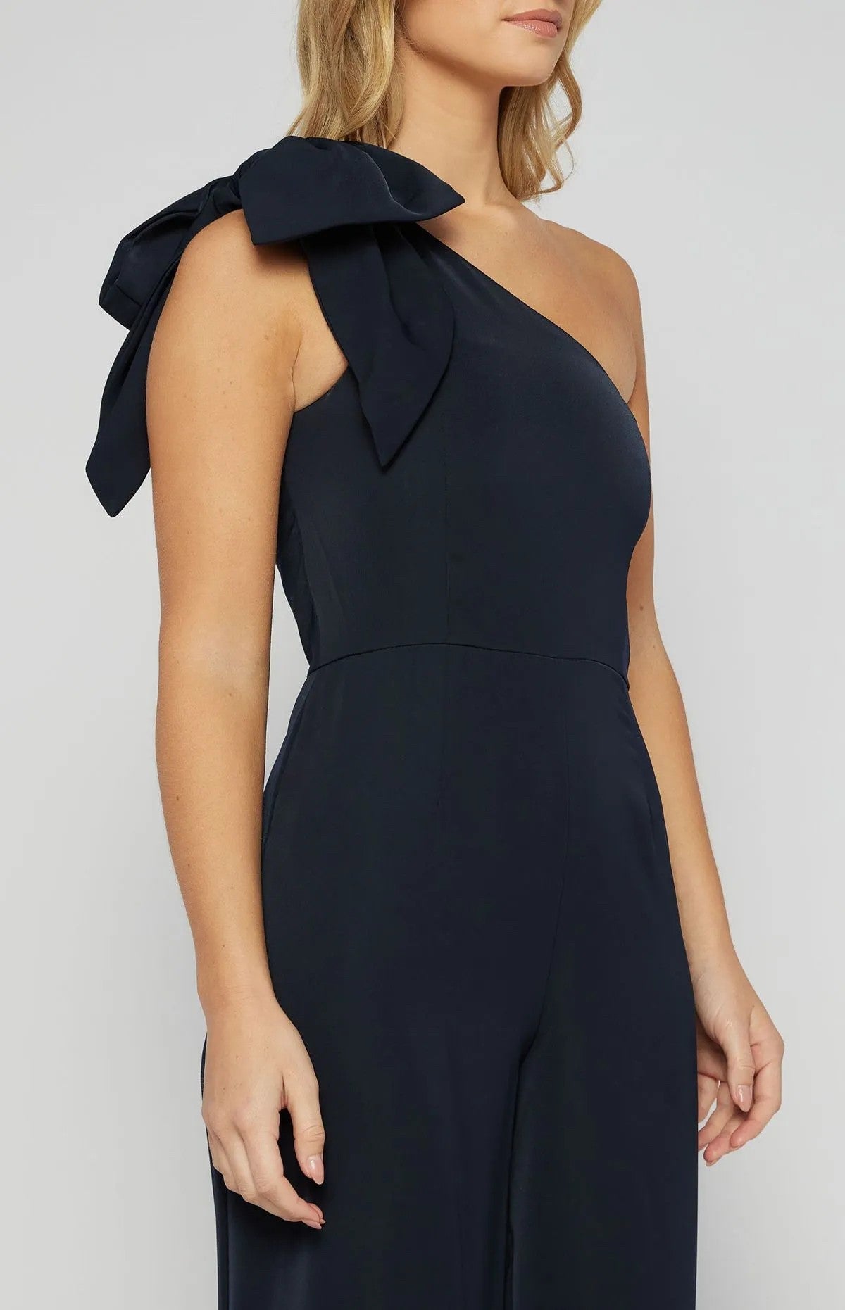 NAVY ONE SHOULDER JUMPSUIT WITH LARGE BOW